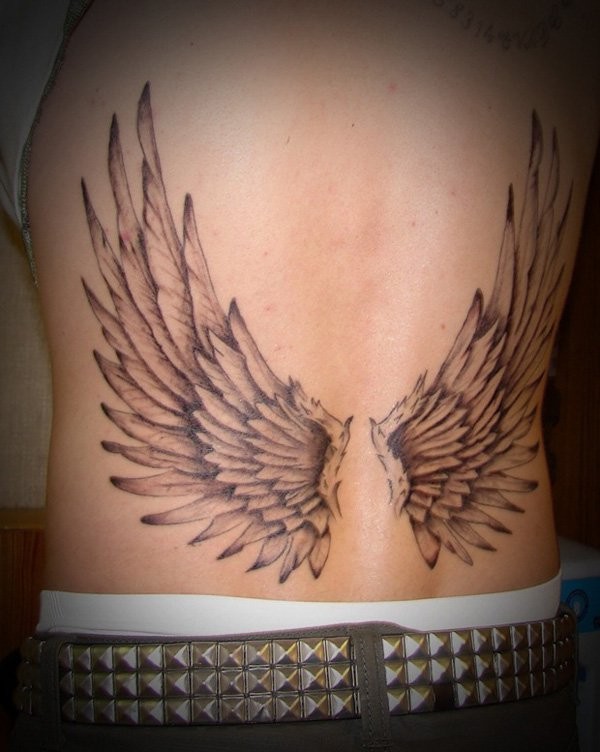 Black and gray style small typical designed angel wings tattoo on waist