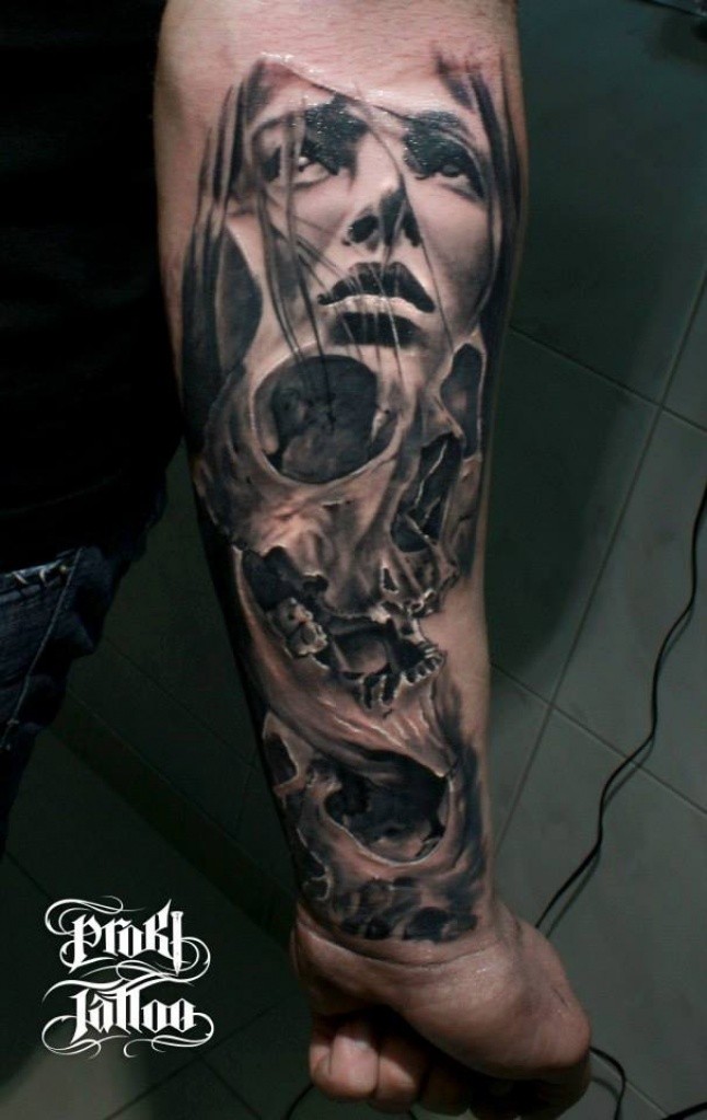 Black and gray style very detailed forearm tattoo of woman face with skull