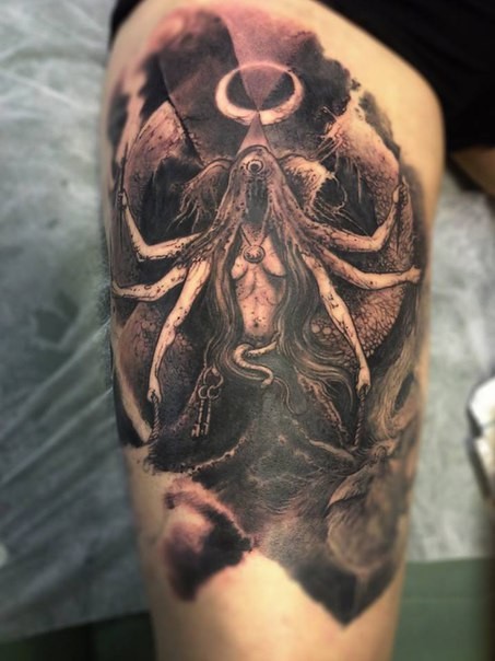Black and gray style very detailed thigh tattoo of mysterious creature