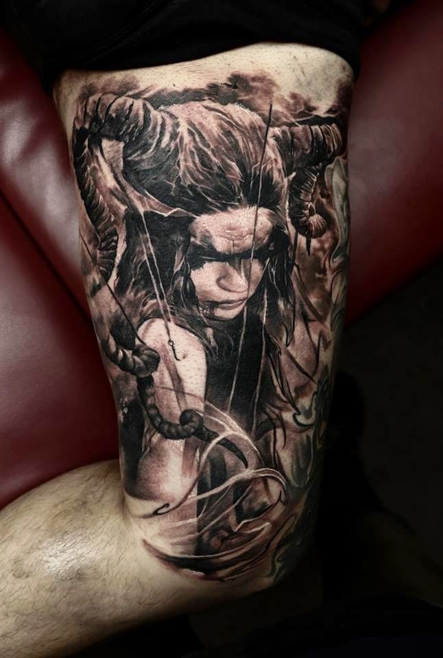 Black and grays style detailed arm tattoo of devils woman