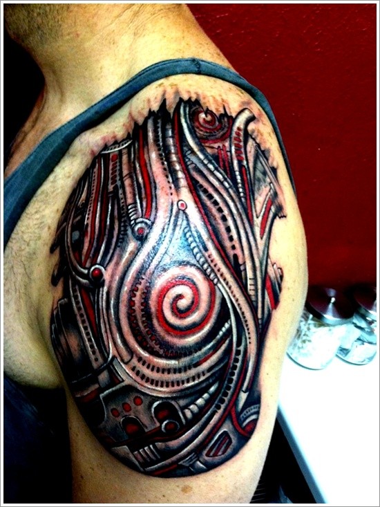 Black and red biomechanical tattoo on shoulder