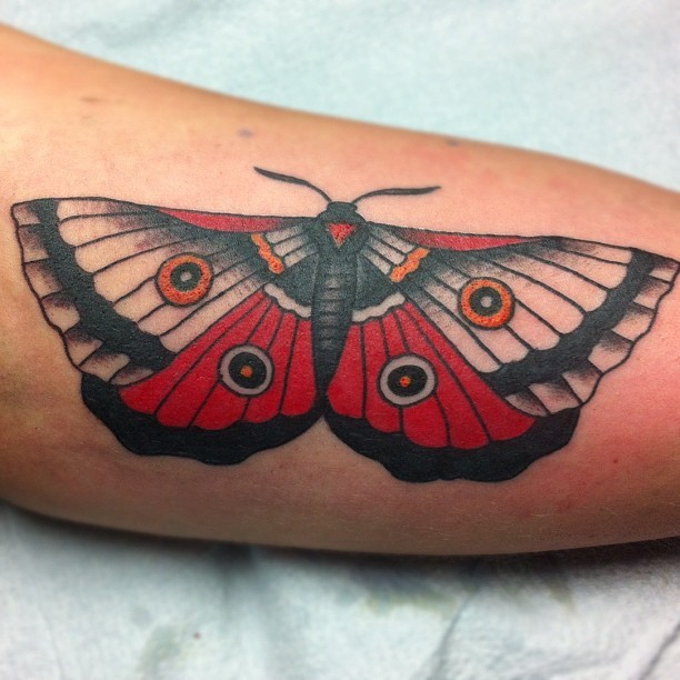 Black and red moth tattoo idea