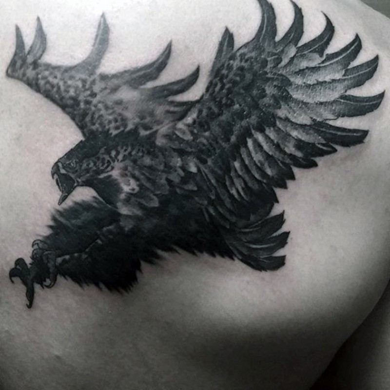 Black and white big flying eagle tattoo on back