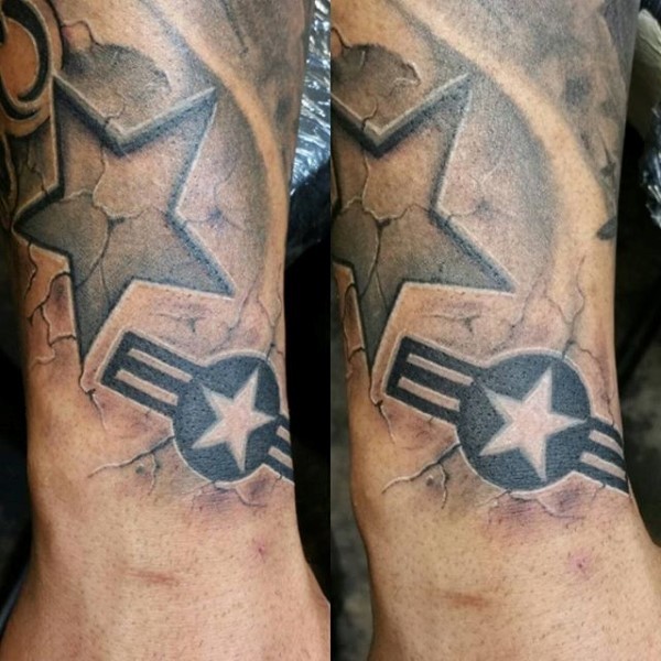 Black and white detailed arm tattoo of American army symbols
