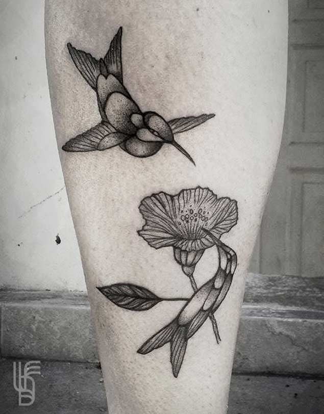 Black and white original design hummingbirds and hibiscus flower tattoo on leg