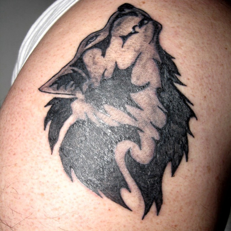 Black and white shoulder tattoo of werewolf