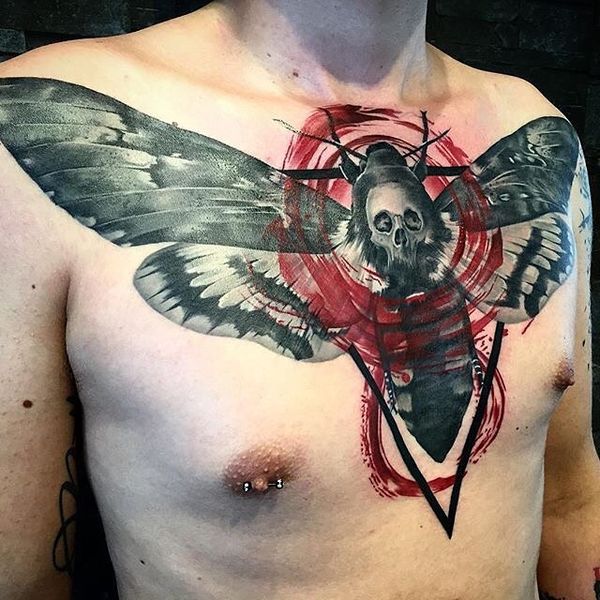 Black butterfly with red figure trash polka tattoo on chest