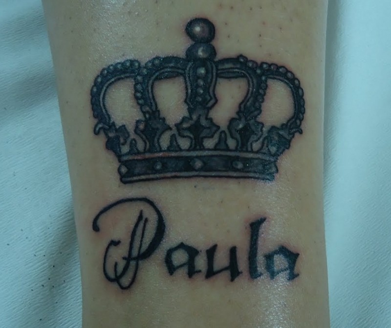 Black crown tattoo with script paula
