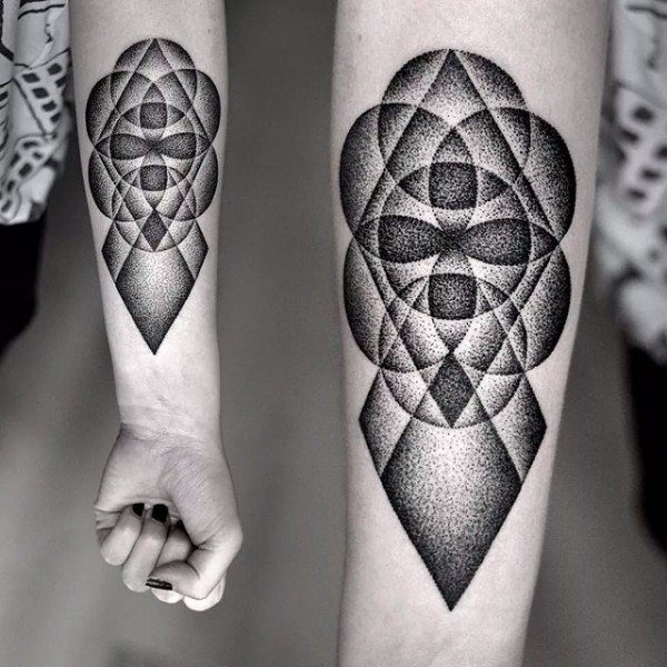 Black dotwork circles geometric forearm tattoo by Kamil Czapiga