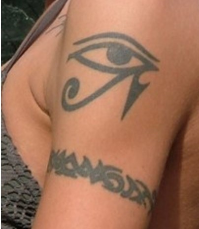Black egyptian eye tattoo on shoulder