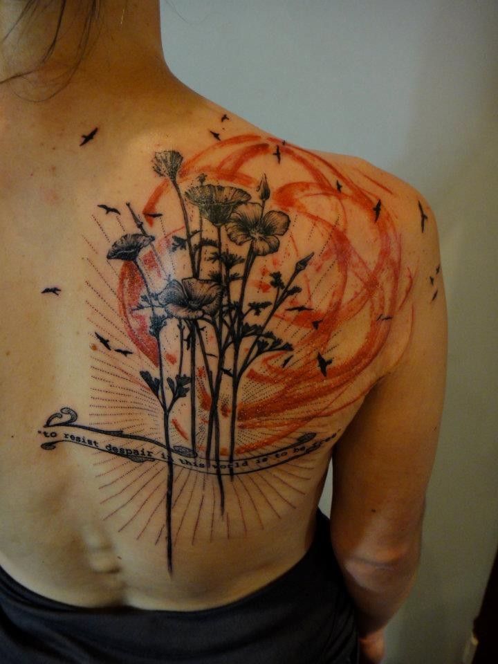 Black flowers tattoo on back