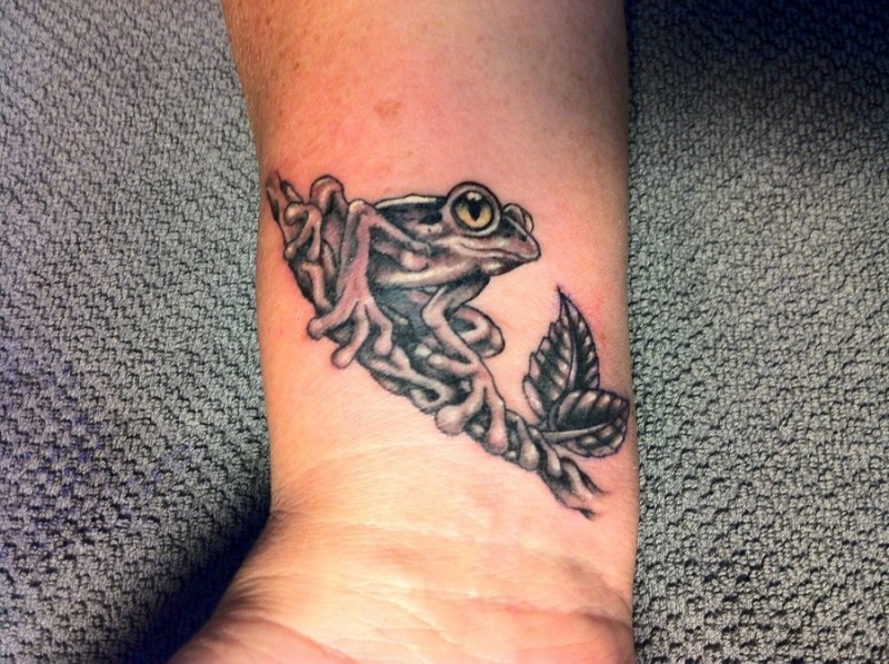 Black gray frog tattoo on wrist