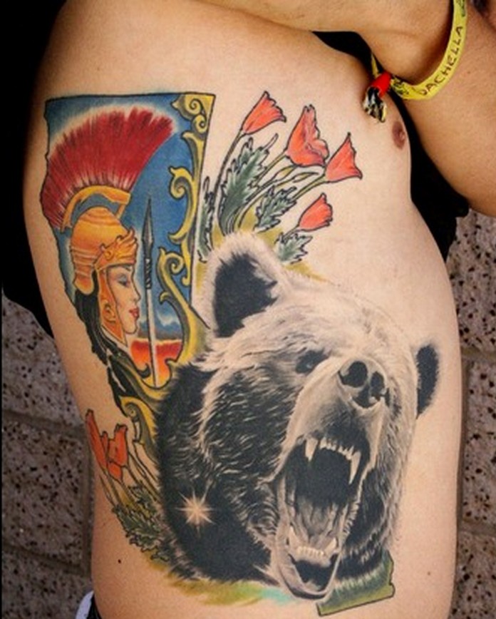 Black gray head of a bear tattoo on ribs