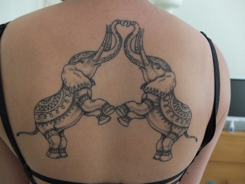 Black gray two elephants tattoo on back