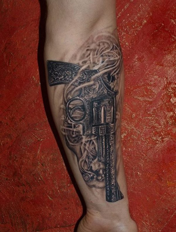 Black gray vintage gun forearm tattoo