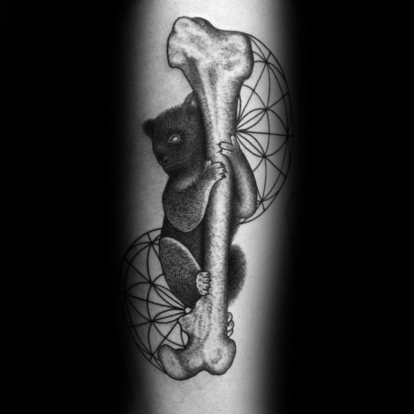 Black ink arm tattoo of big human bone with sloth