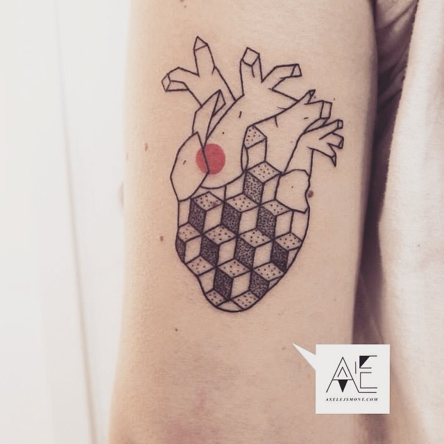Black ink arm tattoo of human heart with geometrical figures