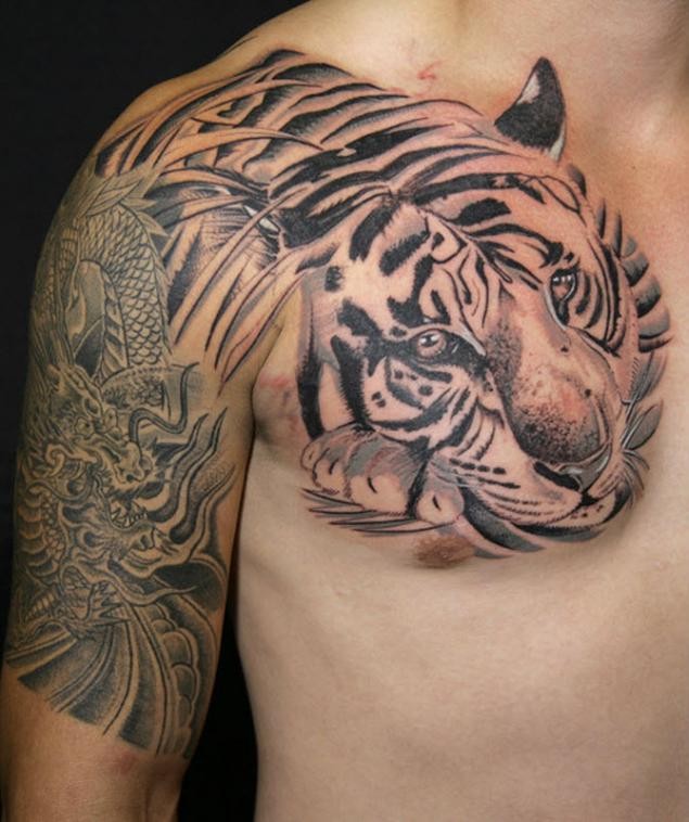 Black ink Asian style chest tattoo of tiger portrait