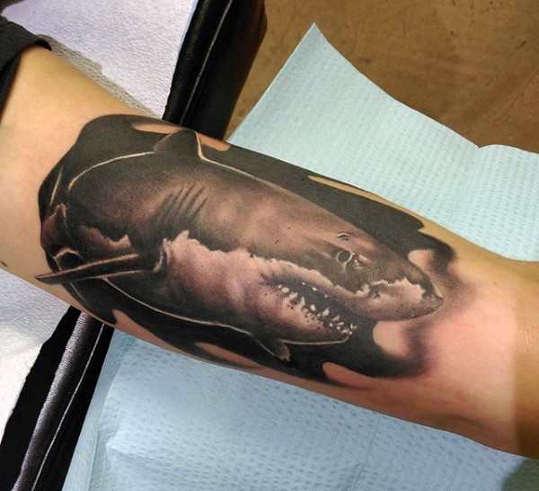 Black ink biceps tattoo of shark
