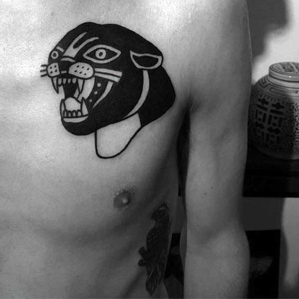 Black ink chest tattoo of cartoon like black panther head