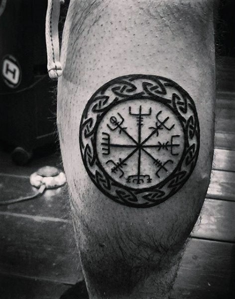 Black ink circle shaped leg tattoo of circle shaped symbol