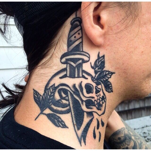 Black ink dagger with skull tattoo on neck