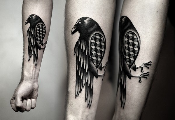 Black ink detailed forearm tattoo of crow with geometrical figures