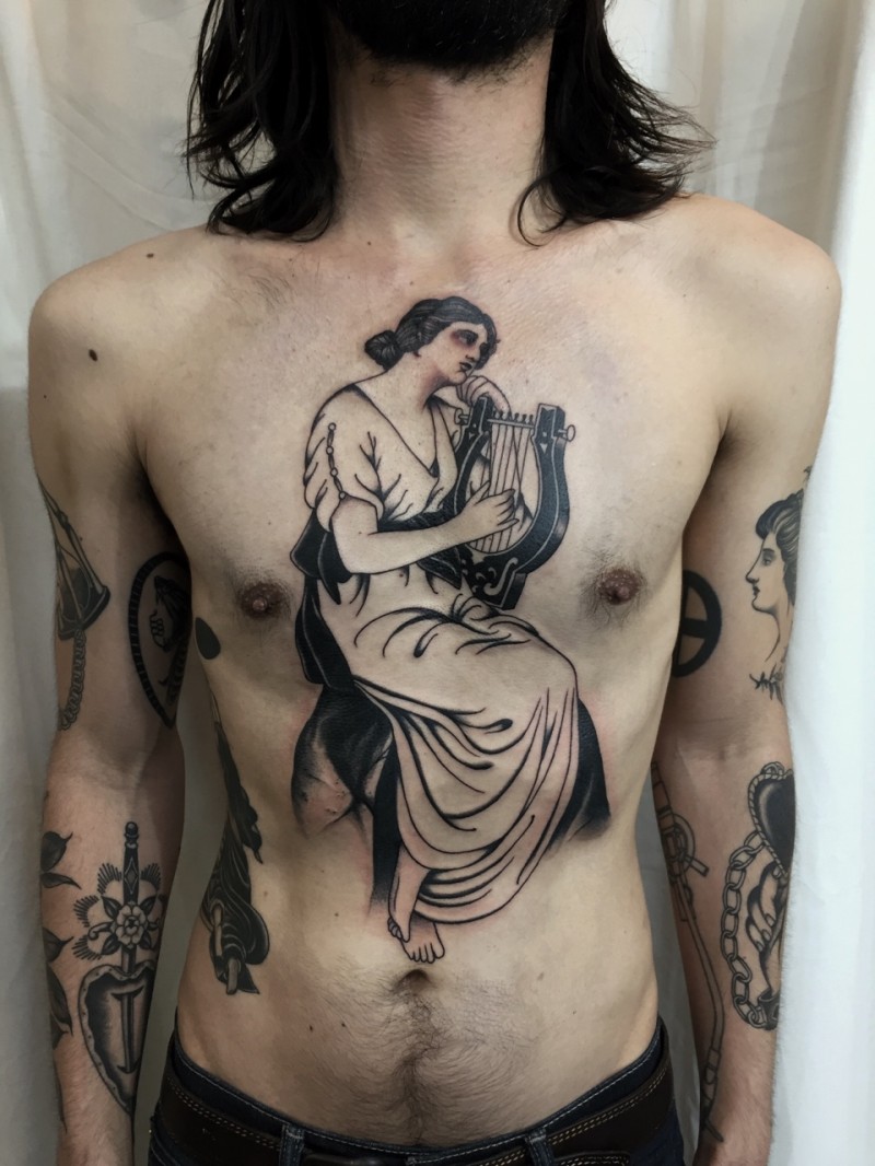 Black ink detailed looking chest tattoo of old woman with harp