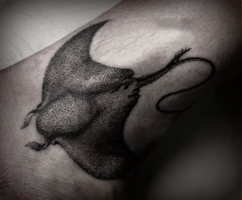 Black ink dot style wrist tattoo of gorgeous ray