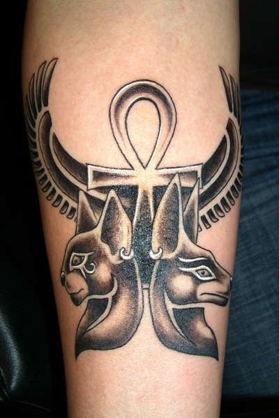 Black ink egyptian deities and symbols of power tattoo