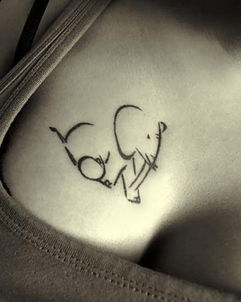 Black ink elephant silhouette tattoo for women