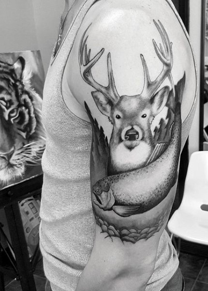 Black ink engraving style shoulder tattoo of deer with fish