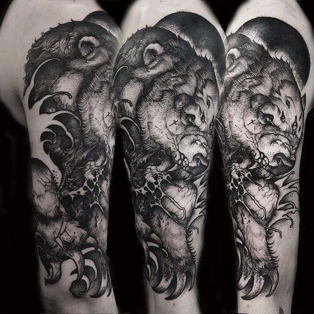 Black ink engraving style shoulder tattoo of demonic bear