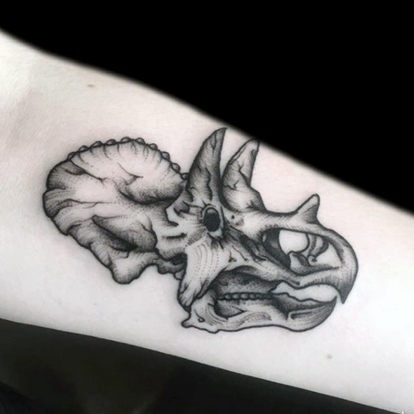 Black ink forearm tattoo of engraving style forearm tattoo of dinosaur skull