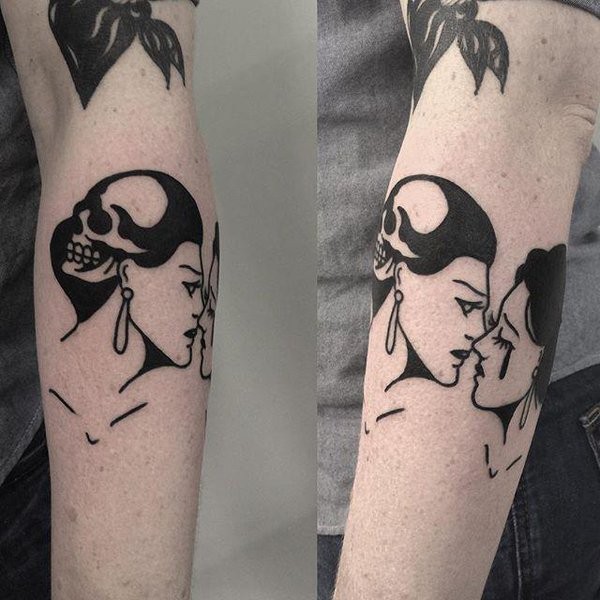 Black ink forearm tattoo of kissing woman couple