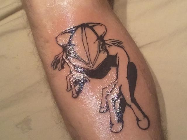 Black ink frog tattoo on leg