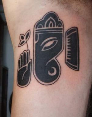 Black ink ganesh symbol tattoo on arm