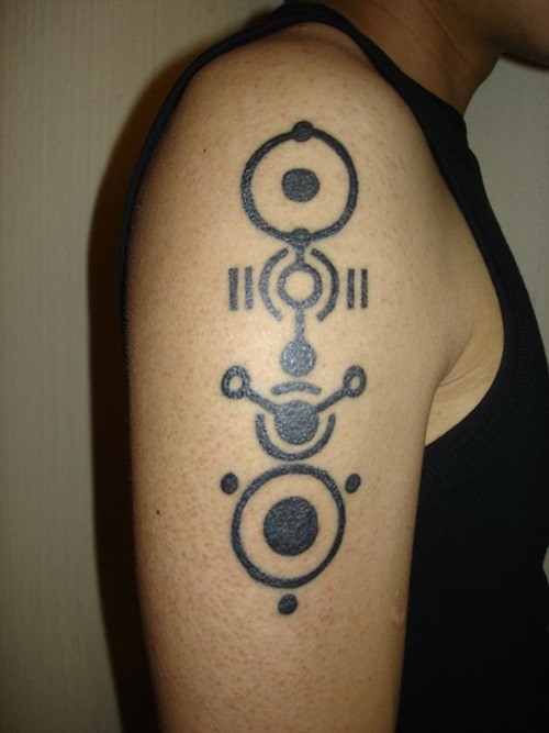 Black ink geek tattoo on shoulder for men