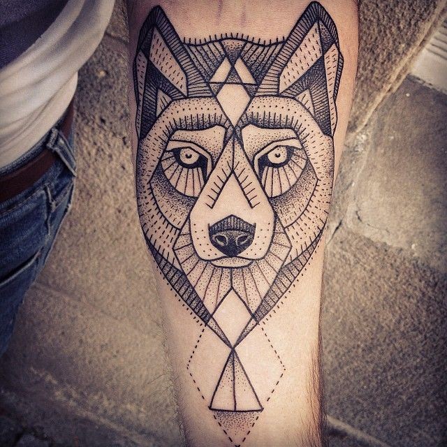 Black ink geometric wolf tattoo on arm