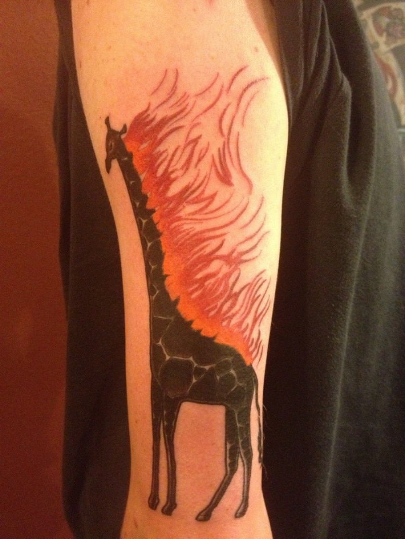 Black ink giraffe with fire tattoo