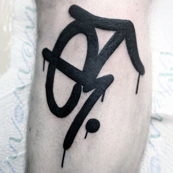Black ink graffiti style leg tattoo of mystical ornament