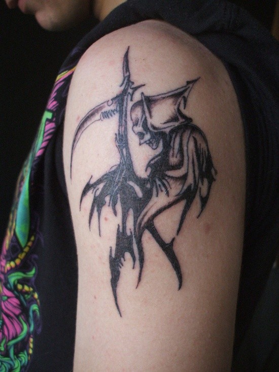 Black ink grim reaper tattoo on shoulder