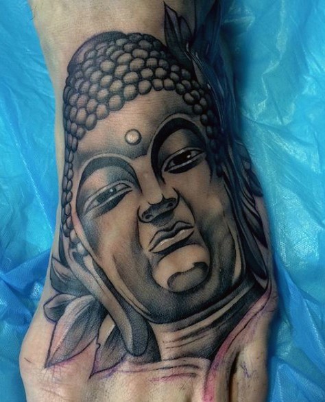Black ink Hinduism style medium sized foot tattoo of Buddha statue