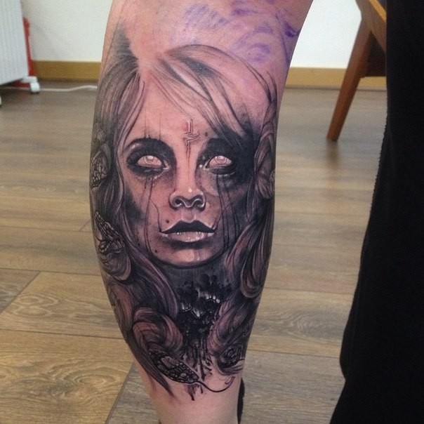Black ink horror style colored leg tattoo of mystical woman portrait