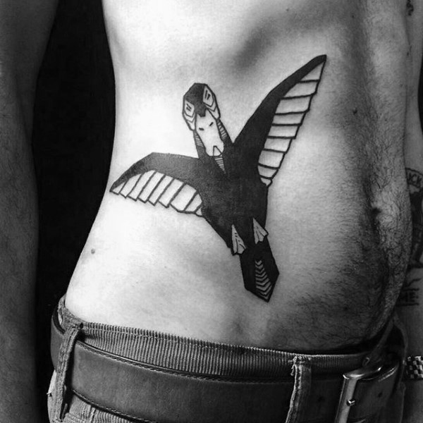 Black ink interesting looking bird tattoo on side
