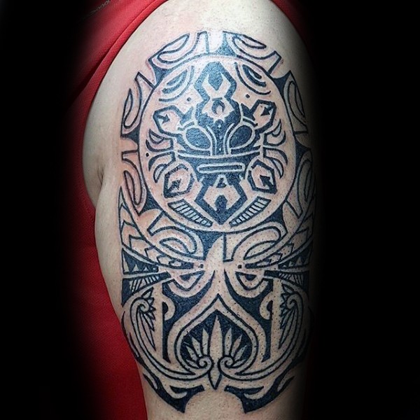 Black ink large shoulder tattoo of Polynesian style ornaments