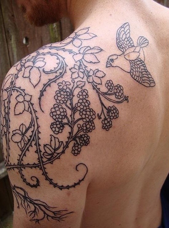 Black ink lines vine with bird tattoo on shoulder