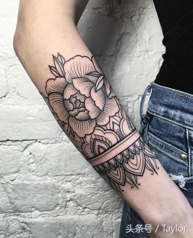 Black ink linework style forearm tattoo of rose