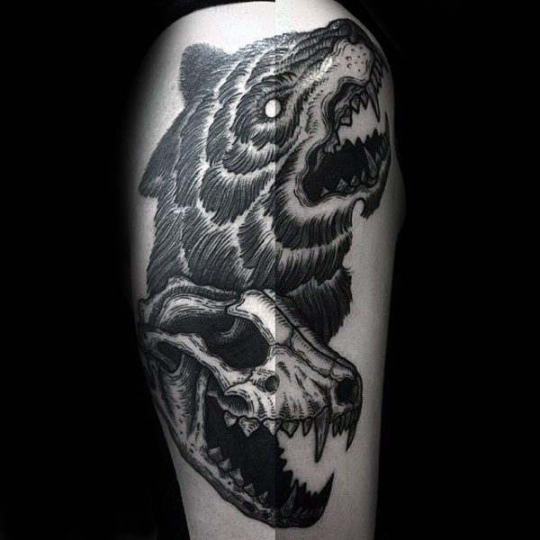 Black ink linework style tattoo of animal skull with bears head
