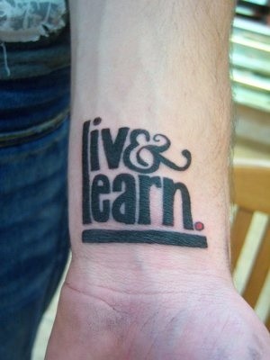 Black ink live learn wrist tattoo
